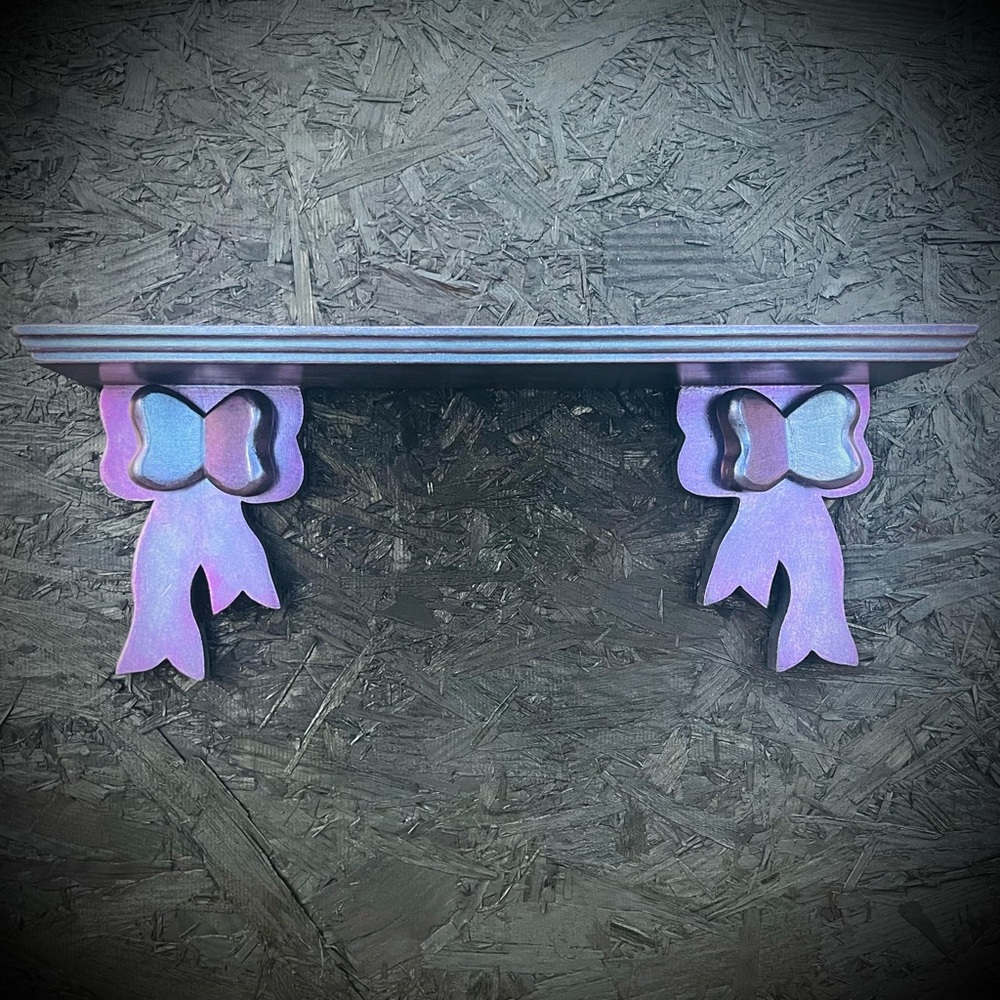 Color Shifting Wooden Wall Shelf with Bow Accents